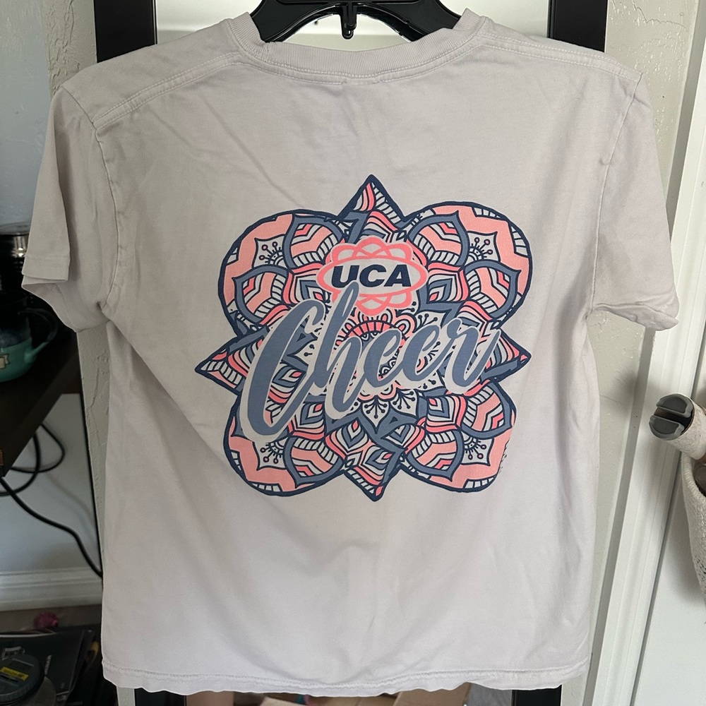 Youth Large/XS in woman’s Varsity T-shirt